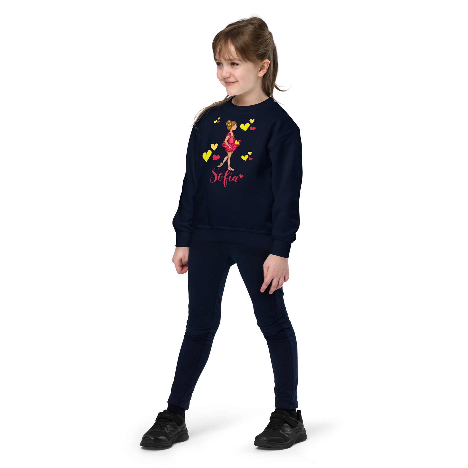 a young girl wearing a sweatshirt and leggings