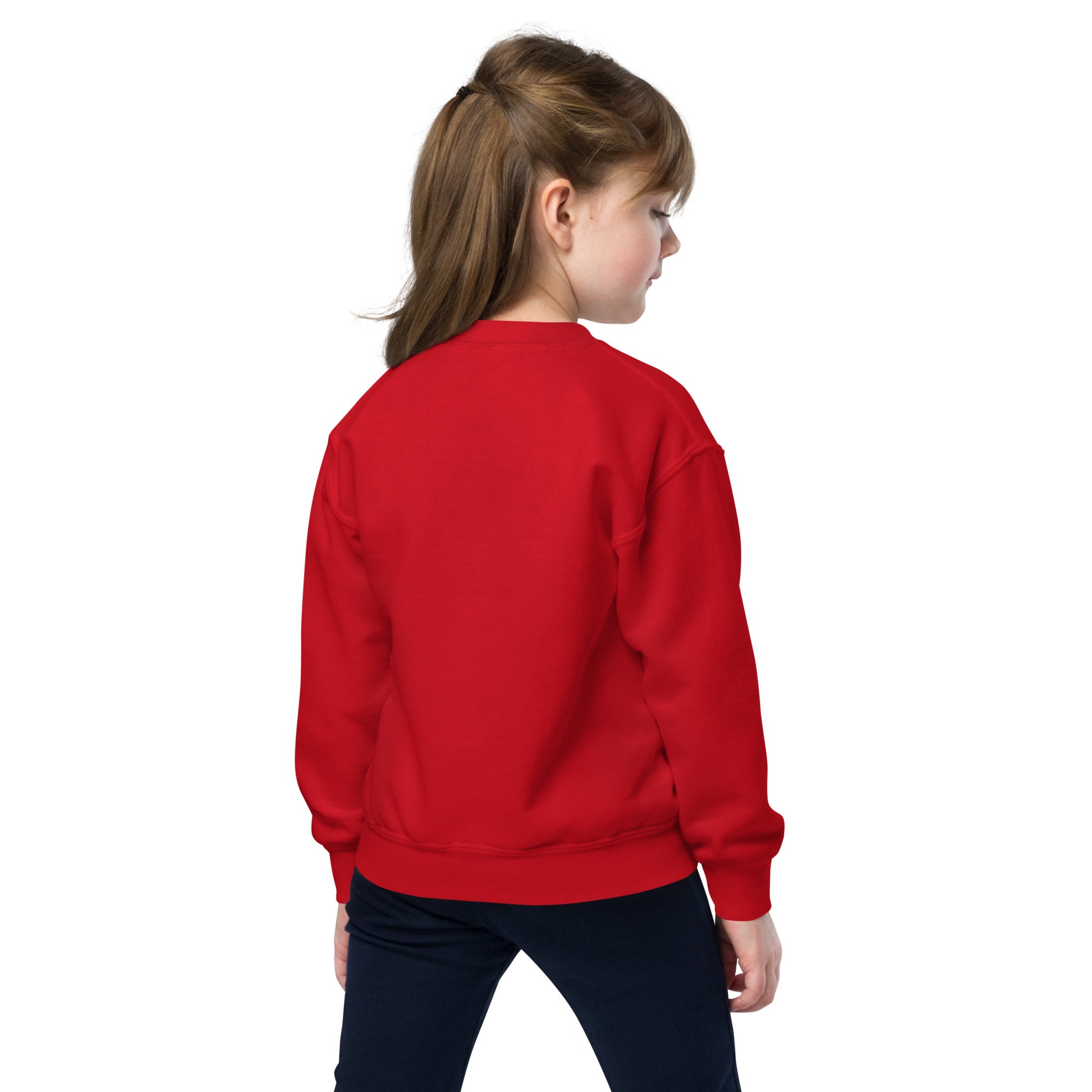 a young girl wearing a red sweatshirt and black pants