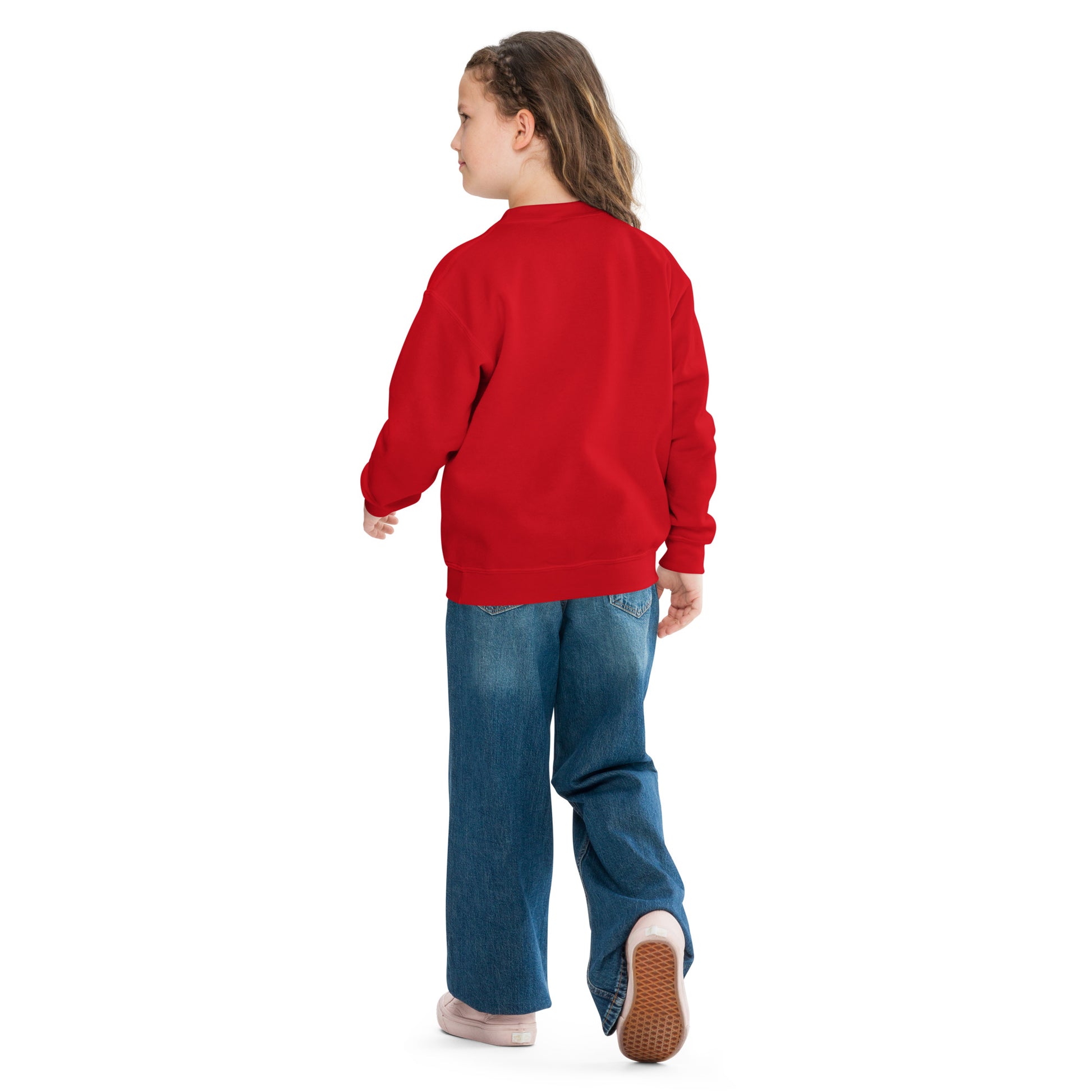 a little girl in a red sweatshirt and jeans
