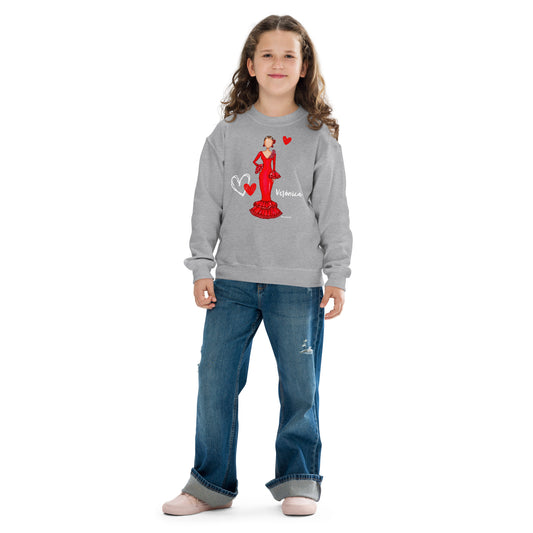 a young girl wearing a grey sweater with a picture of a woman on it