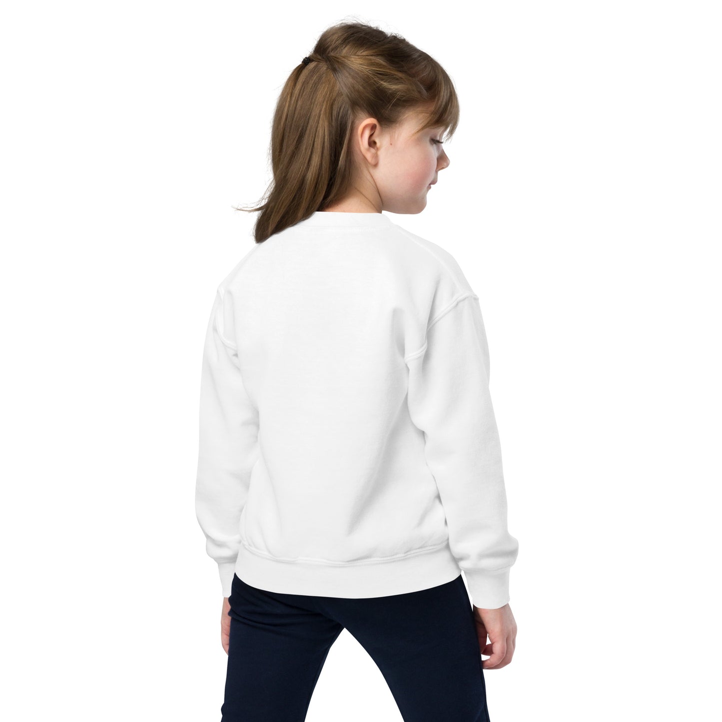 a young girl wearing a white sweatshirt and black pants