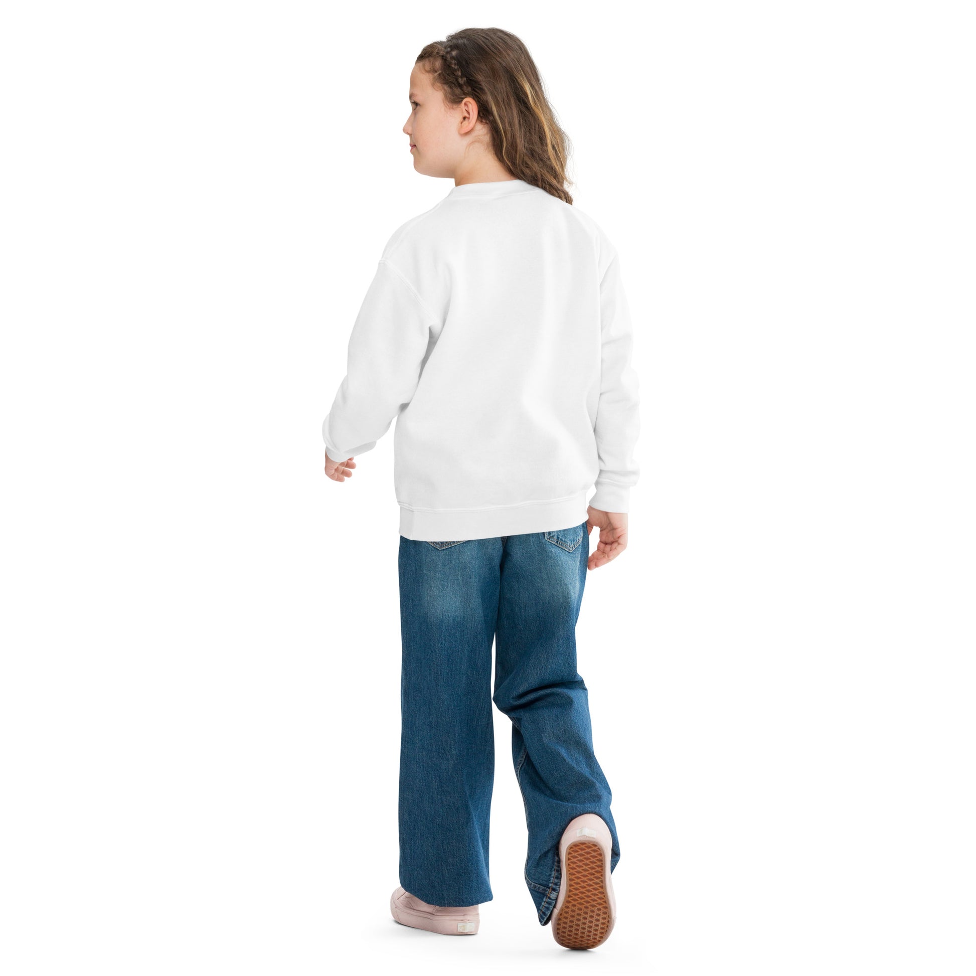 a little girl in a white sweatshirt and jeans