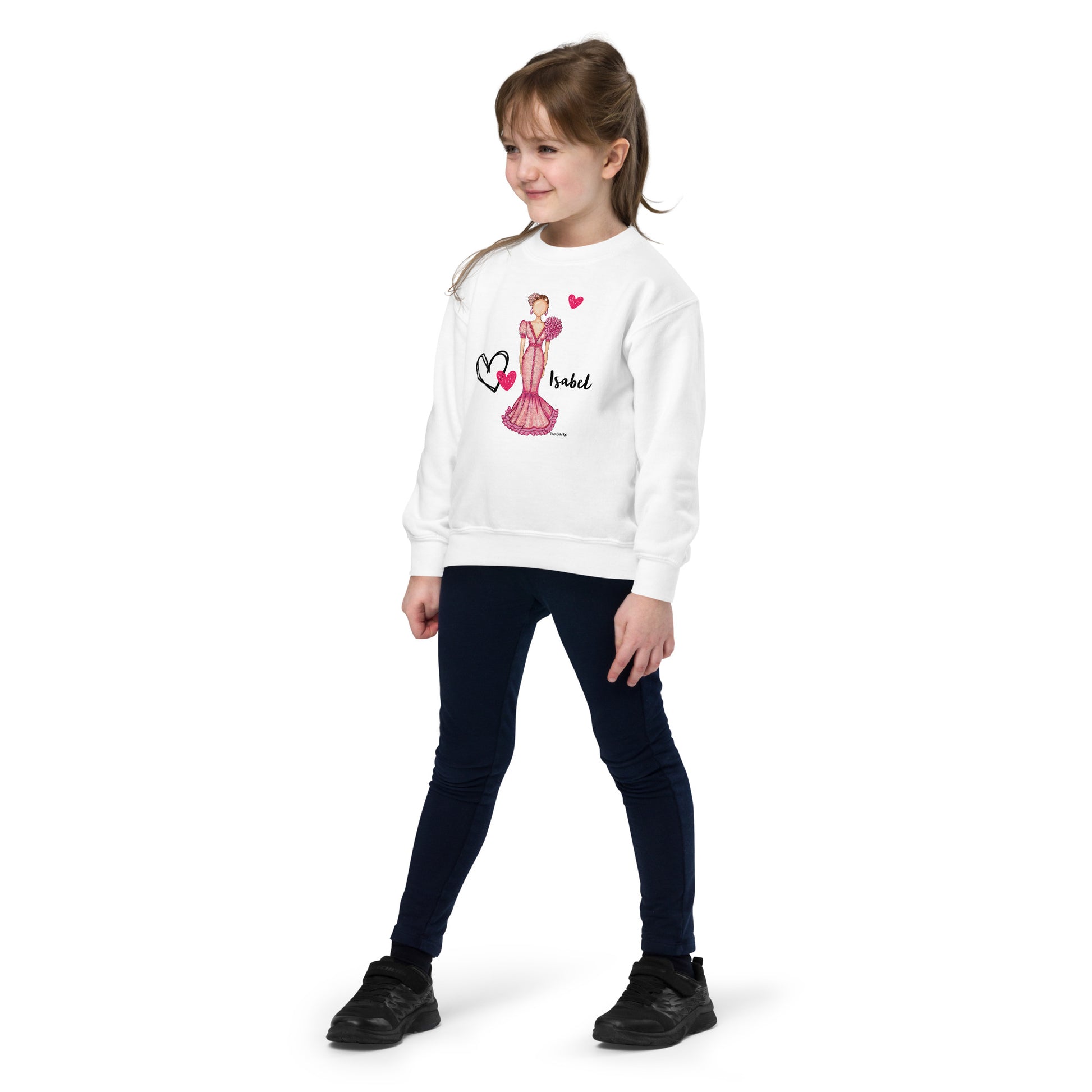 a little girl wearing a white sweatshirt and jeans